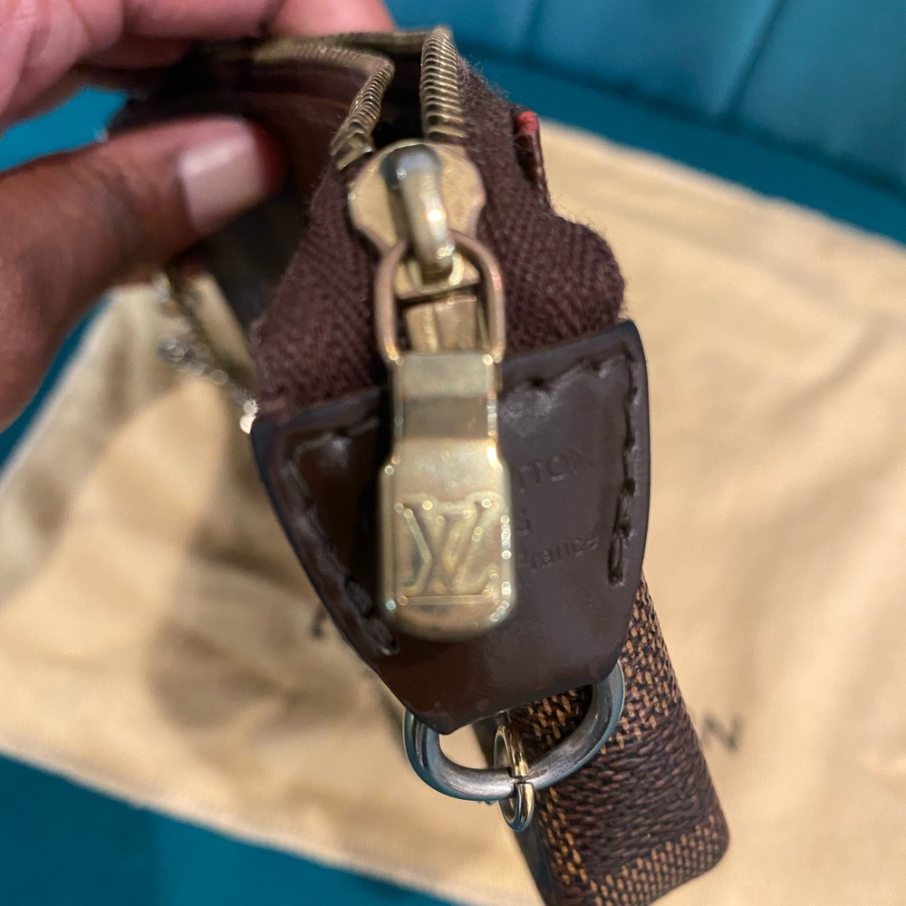 100% authentic Louis Vuitton damier mini pochette